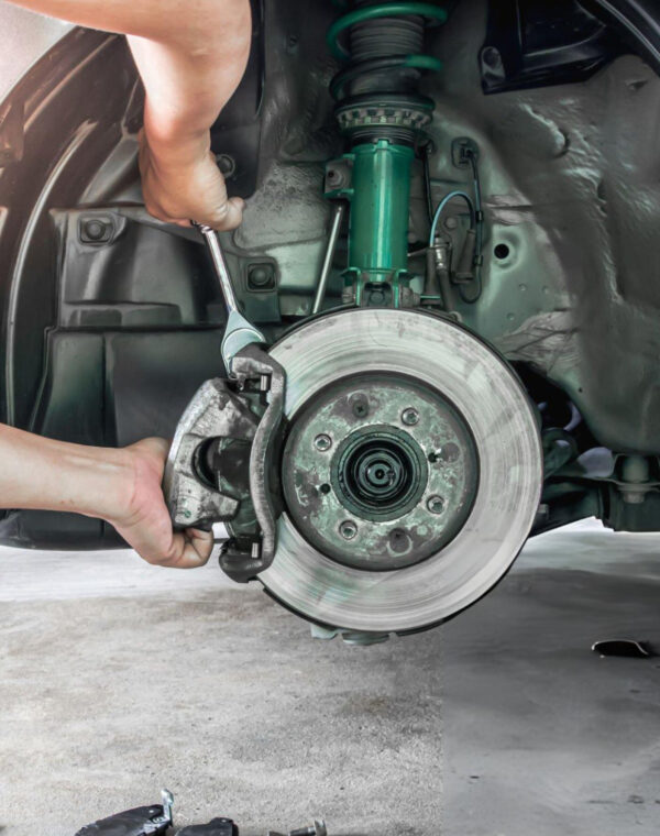 dl.beatsnoop.com-3000-p74Ij8bWnx Neil Arnold Tyres And Autos Mechanic repairing car brakes with wrench
