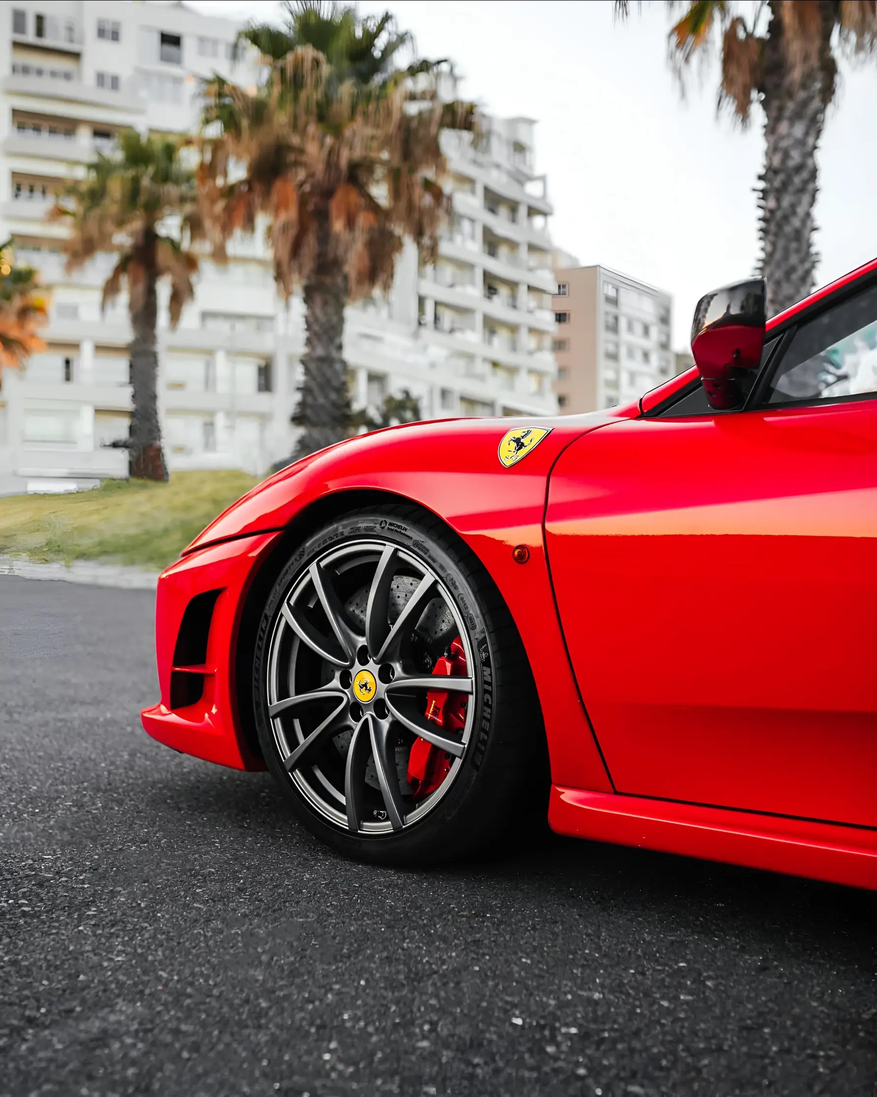 Red Ferrari 458 Italia parked on city street